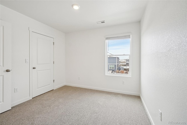 unfurnished bedroom featuring carpet