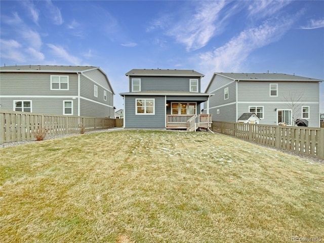 back of house featuring a yard