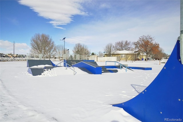 view of yard layered in snow