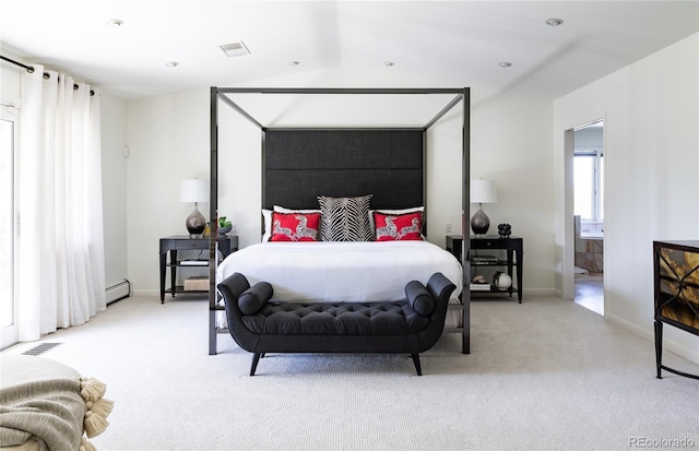 bedroom with baseboards, visible vents, baseboard heating, and carpet