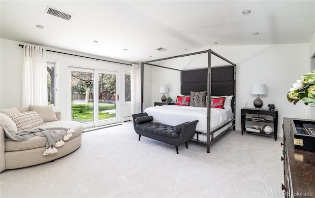 bedroom with visible vents, access to outside, vaulted ceiling, and light colored carpet
