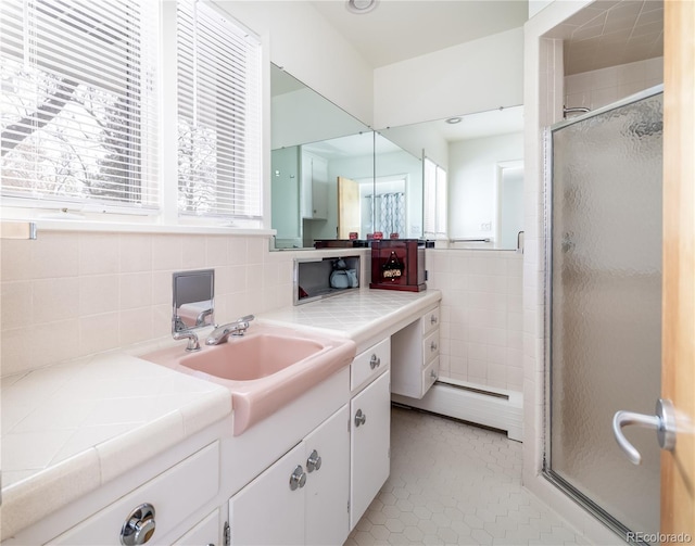 full bath with vanity, tile patterned floors, and a shower stall