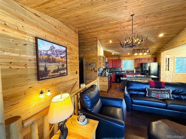 living room featuring a notable chandelier, wood ceiling, lofted ceiling, and wood walls