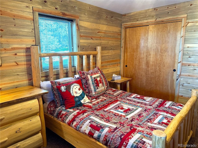 bedroom with wood walls