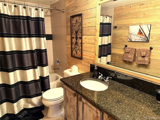 full bathroom with toilet, wooden walls, and vanity