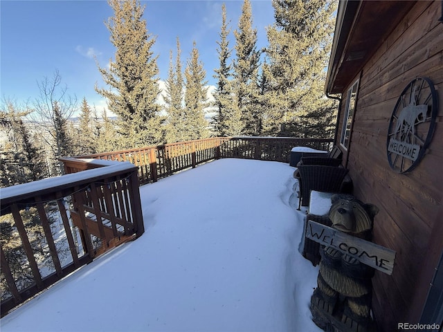 view of snow covered deck