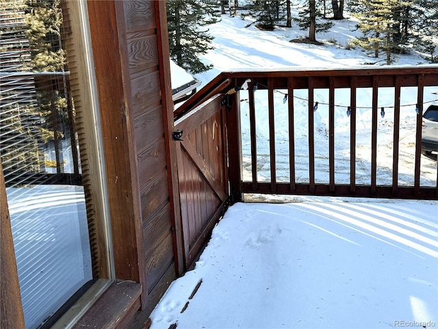 view of snow covered deck