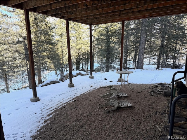 view of yard layered in snow