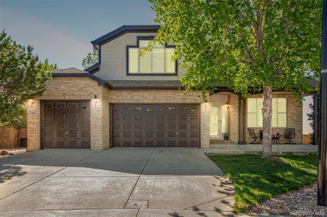 7852 Solstice Way, Castle Rock, CO 80108 - view of front of home with brick siding, concrete driveway, a porch, and an attached garage