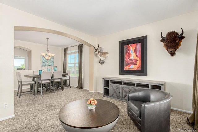 7852 Solstice Way, Castle Rock, CO 80108 - living room with arched walkways, carpet, a chandelier, baseboards, and ornamental molding