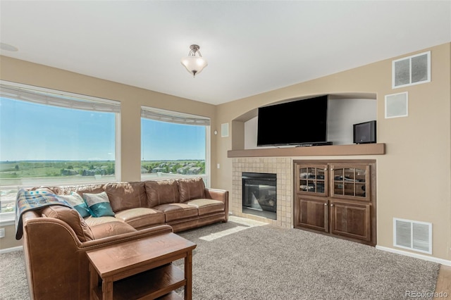7852 Solstice Way, Castle Rock, CO 80108 - living room featuring carpet, baseboards, and a tile fireplace