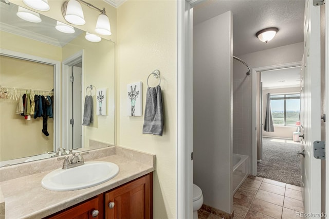7852 Solstice Way, Castle Rock, CO 80108 - bathroom featuring ornamental molding, vanity, bathing tub / shower combination, toilet, and tile patterned flooring