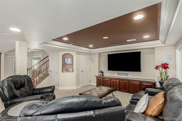 7852 Solstice Way, Castle Rock, CO 80108 - living room featuring a tray ceiling, light colored carpet, ornamental molding, baseboards, and stairs