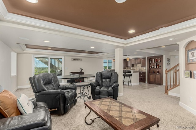 7852 Solstice Way, Castle Rock, CO 80108 - living area featuring a raised ceiling, ornamental molding, recessed lighting, stairway, and baseboards