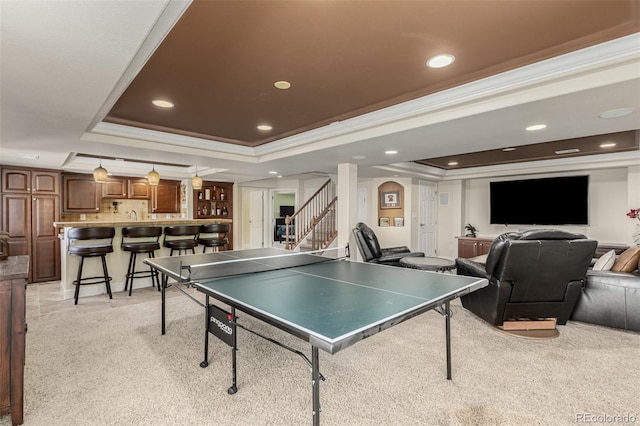 7852 Solstice Way, Castle Rock, CO 80108 - recreation room featuring a raised ceiling, ornamental molding, light carpet, and recessed lighting