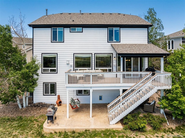 7852 Solstice Way, Castle Rock, CO 80108 - rear view of house featuring a patio area, stairway, and a shingled roof