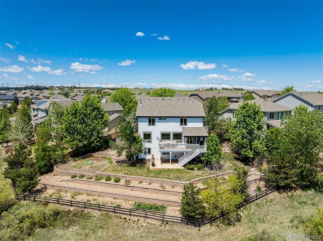 7852 Solstice Way, Castle Rock, CO 80108 - rear view of property with stairway, a wooden deck, a fenced backyard, a residential view, and a shingled roof