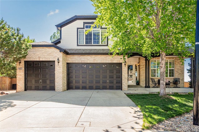 7852 Solstice Way, Castle Rock, CO 80108 - view of front facade with brick siding, driveway, a garage, and a porch