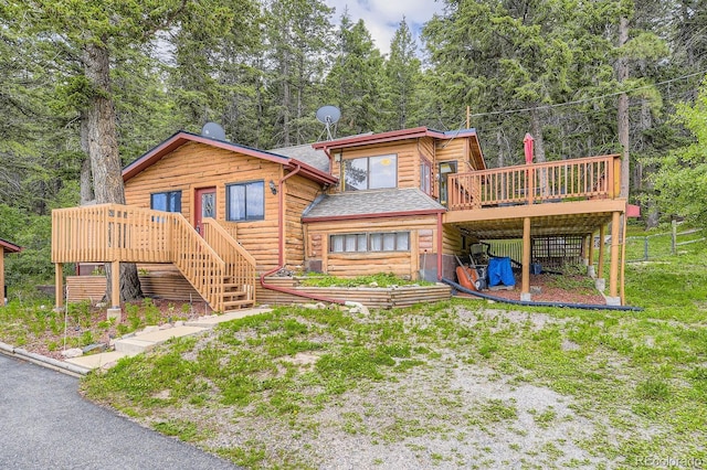 8758 S Murphy Gulch Rd, Littleton, CO 80127 - rear view of property featuring stairs, a wooden deck, and faux log siding