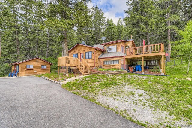 8758 S Murphy Gulch Rd, Littleton, CO 80127 - view of front of house with a deck and stairs