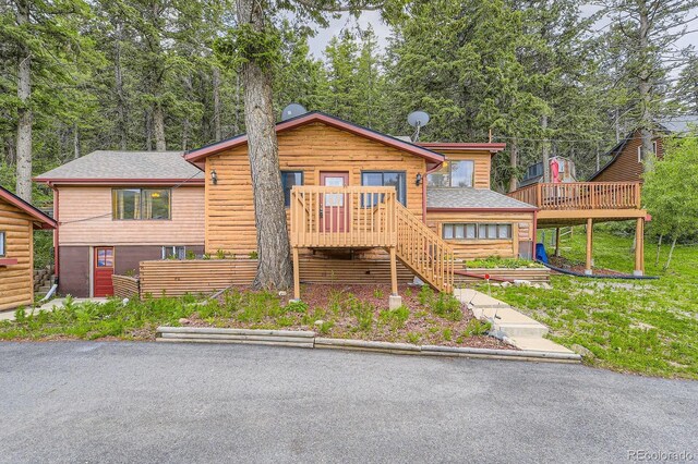 8758 S Murphy Gulch Rd, Littleton, CO 80127 - chalet / cabin featuring stairway, a wooden deck, and roof with shingles