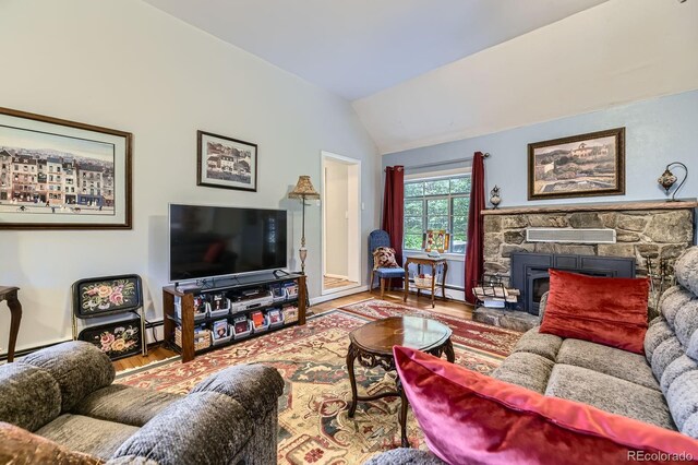 8758 S Murphy Gulch Rd, Littleton, CO 80127 - living area featuring wood finished floors, vaulted ceiling, and baseboard heating