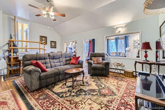 8758 S Murphy Gulch Rd, Littleton, CO 80127 - living room featuring a ceiling fan, vaulted ceiling, and wood finished floors