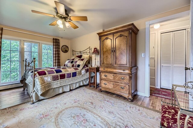 8758 S Murphy Gulch Rd, Littleton, CO 80127 - bedroom with wood finished floors and ceiling fan