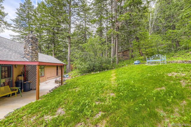 8758 S Murphy Gulch Rd, Littleton, CO 80127 - view of yard featuring a patio area