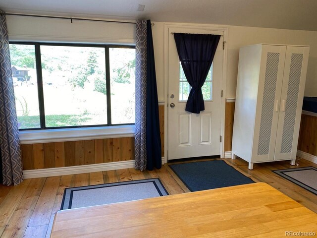 8758 S Murphy Gulch Rd, Littleton, CO 80127 - entrance foyer with wood-type flooring and baseboards