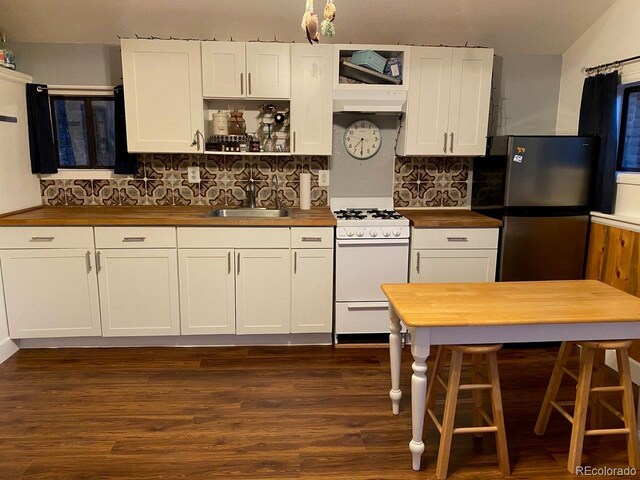 8758 S Murphy Gulch Rd, Littleton, CO 80127 - kitchen featuring gas range gas stove, wooden counters, freestanding refrigerator, and tasteful backsplash