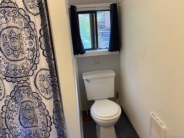 8758 S Murphy Gulch Rd, Littleton, CO 80127 - bathroom with tile patterned flooring and curtained shower