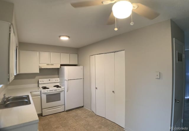 6600 Knox Ct, Denver, CO 80221 - kitchen with white appliances, a sink, under cabinet range hood, a ceiling fan, and light countertops