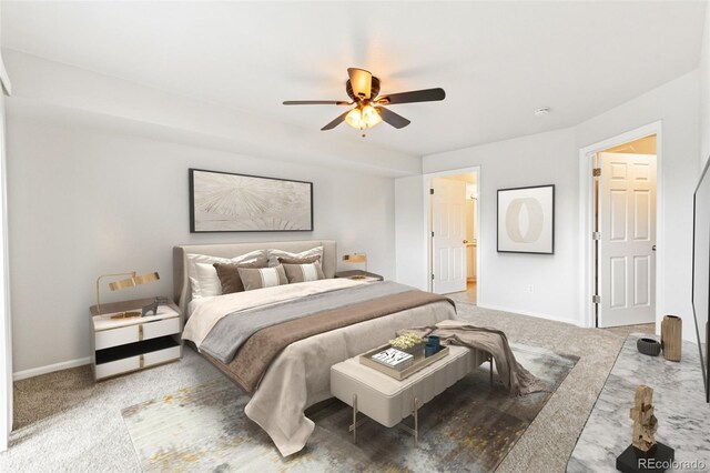 1461 S Danube Way Unit 104, Aurora, CO 80017 - carpeted bedroom featuring baseboards and ceiling fan