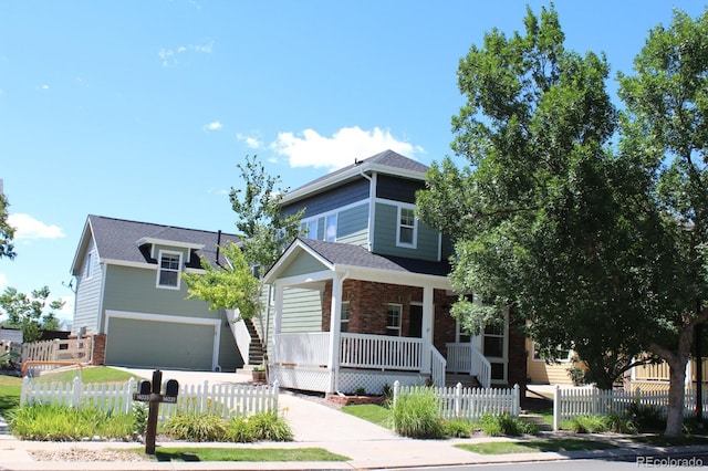 view of front of house featuring covered porch and a garage