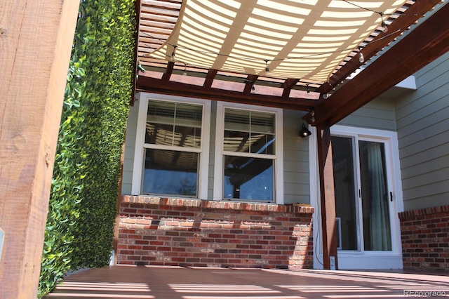 doorway to property with a pergola