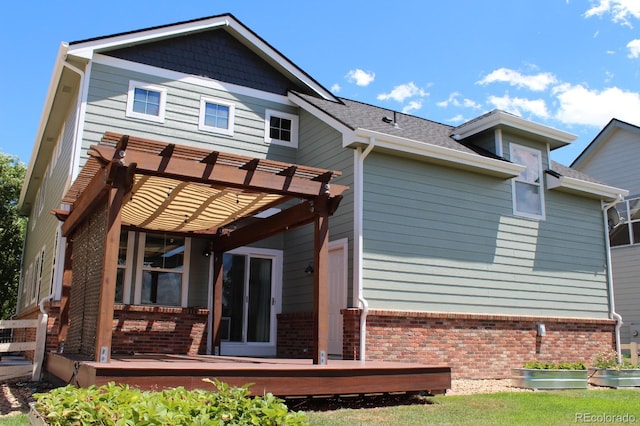 back of house with a pergola and a deck