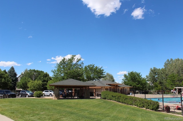 view of yard with a community pool