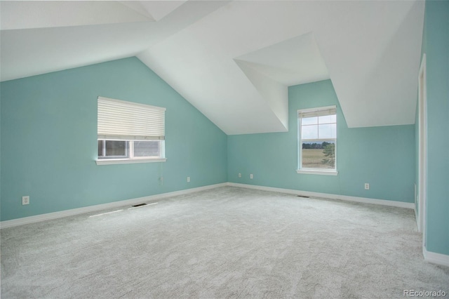 bonus room featuring carpet floors and lofted ceiling