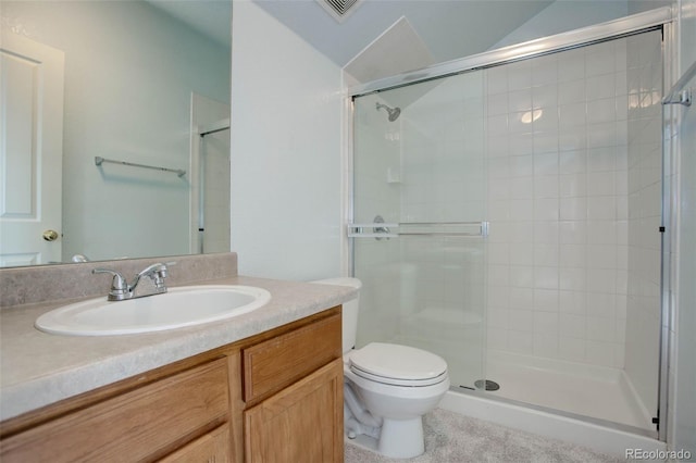 bathroom featuring vanity, toilet, and walk in shower