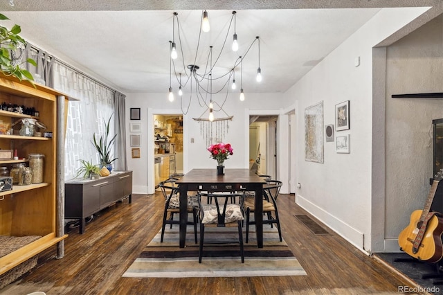 dining space featuring dark hardwood / wood-style flooring