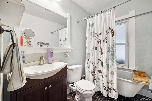 full bathroom featuring vanity, toilet, and shower / tub combo with curtain