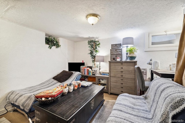 carpeted bedroom featuring a textured ceiling