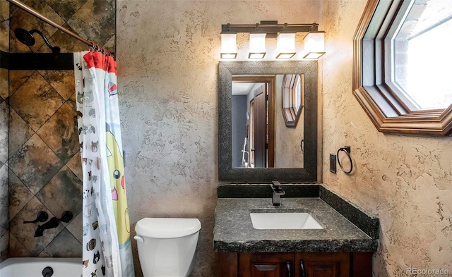 full bathroom with toilet, vanity, and shower / tub combo