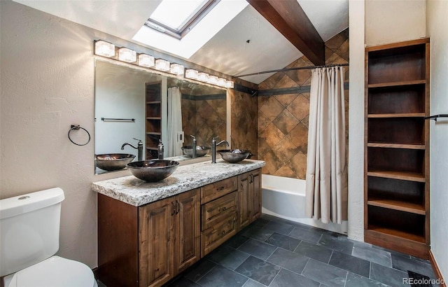 full bathroom with toilet, a skylight, beam ceiling, shower / bath combo, and vanity