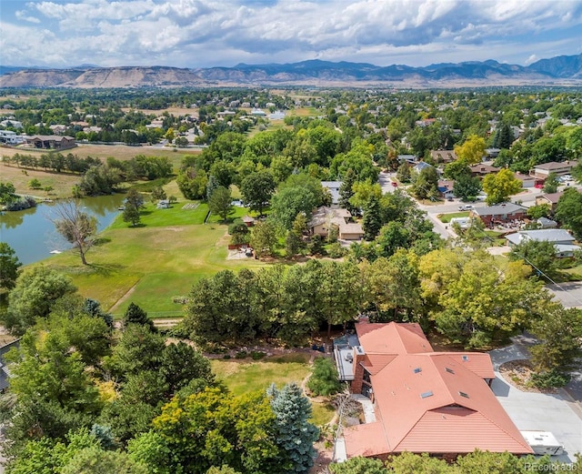 aerial view featuring a water and mountain view