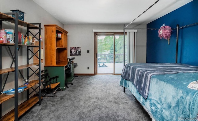 carpeted bedroom with access to outside and baseboards
