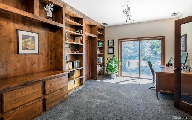 home office featuring dark carpet and visible vents