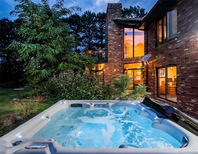 view of pool featuring a hot tub