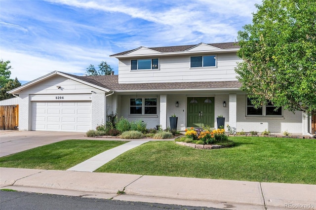 view of front of home with a garage and a front yard